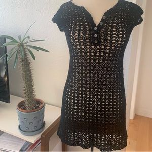 S/48. Black crochet tunic with v-neck and button panel, 100%cotton